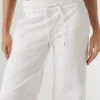 Jeans a vita media e vestibilità ampia – Eva