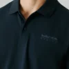 Polo in piqué con stampa sul retro