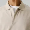 Polo in piqué con stampa sul retro