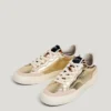 Sneakers dorate con dettagli animalier