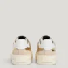 Sneakers dorate con dettagli animalier