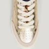 Sneakers dorate con dettagli animalier