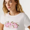 T-shirt con logo floreale stampato T-shirt con logo floreale stampato