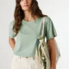 T-shirt con logo in strass