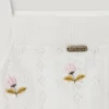 Top a maglia pointelle con fiori ricamati Top a maglia pointelle con fiori ricamati