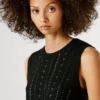 Top in maglia con paillettes Top in maglia con paillettes
