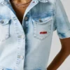 Tuta lunga in denim dalla vestibilità regolare Tuta lunga in denim dalla vestibilità regolare